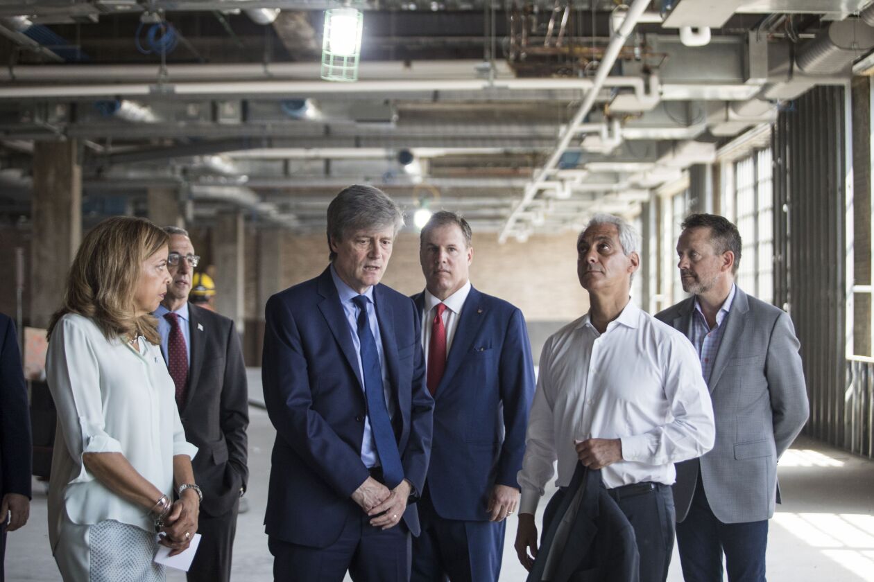 Andrea Zopp (left), CEO of World Business Chicago, Alex Gourlay (center), president of Walgreens, and Mayor Rahm Emanuel tour the 5th floor of the old main Post Office Building, 433 W. Van Buren St., on Monday. | Ashlee Rezin/Sun-Times